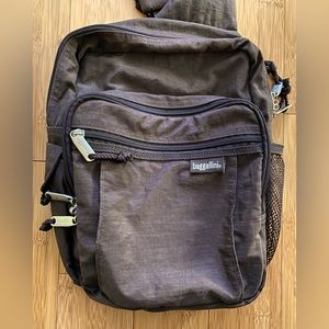 Baggallini brown crossbody bag with many pockets.